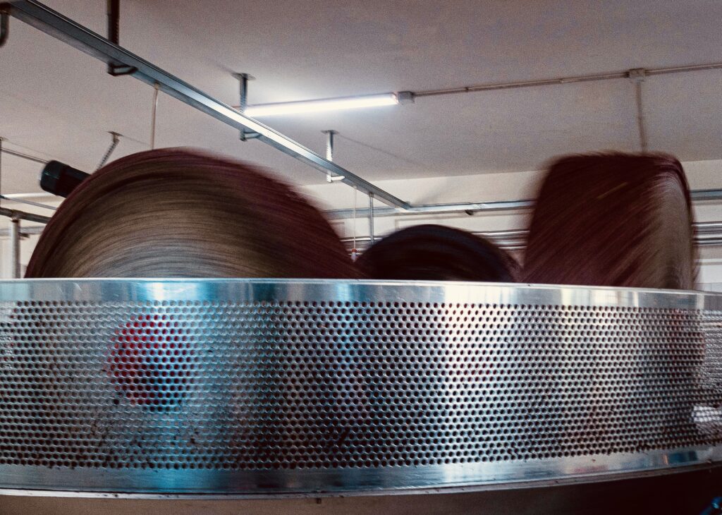 Stone press for olive oil processing
